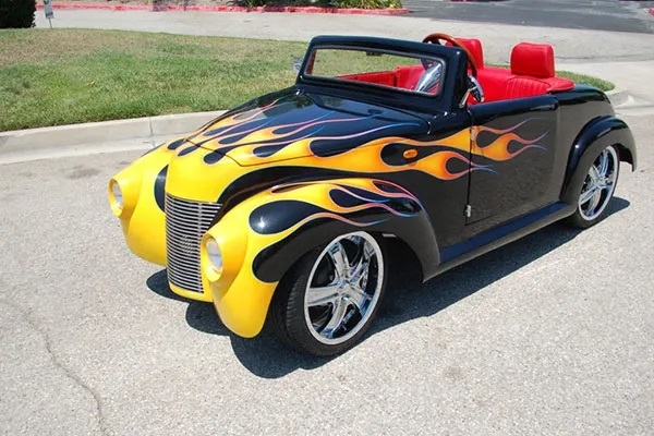 Black 39 Roadster with Yellow Flames affordable golf cart rental, golf cart rent georgia